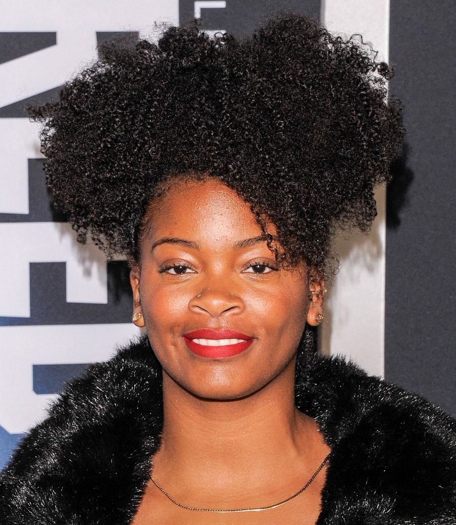 Celebrity with black curly hair