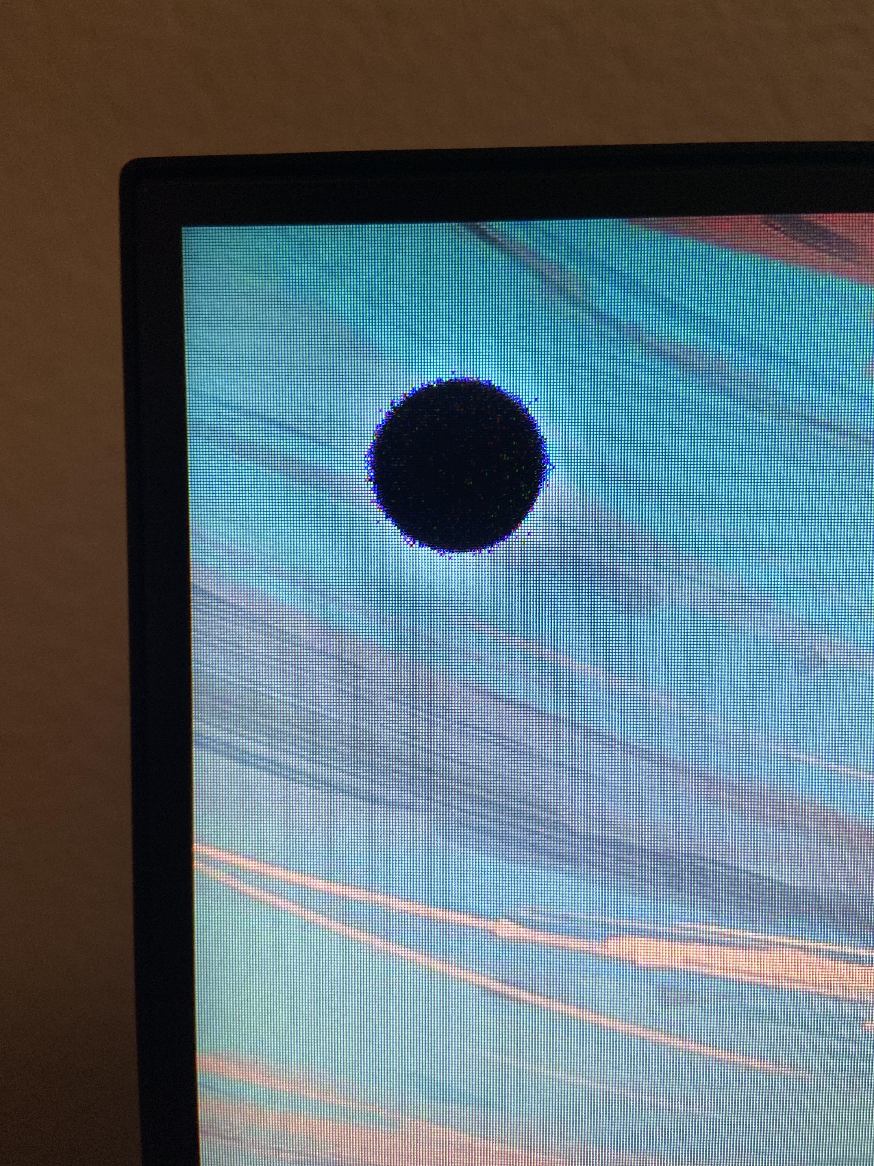 Dark spot on monitor screen